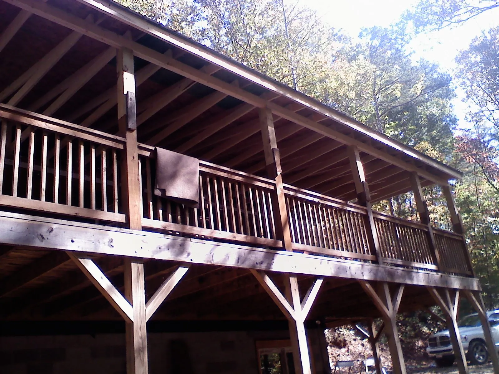Timber framing under a new elevated porch and deck — Roof Leak Repair in Whitefish by Roofing Brothers